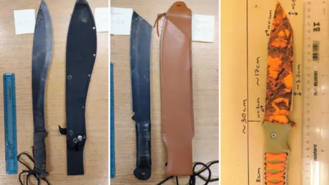 Cleveland Police Two large black machetes, which have strong looking handles and fearsome large chopping blades, and a sinister looking orange and black knife.