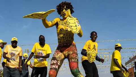 Supporters of Yoweri Museveni, Uganda's president, dance during a campaign rally ahead of presidential elections in Kampala, Uganda, on Tuesday, Jan. 13, 2026