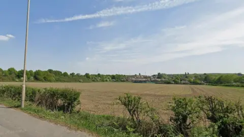 Google Field beyond a hedge