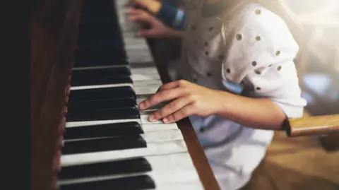 Getty Images A child playing the piano
