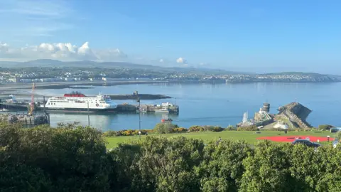 Overlooking Douglas bay, with the Manxman ferry in the harbour and clear blue skies