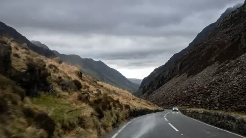 Car moving through the mountains