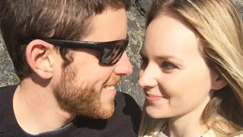 Lissie Harper Andrew and Lissie Harper take a selfie while smiling at each other.
