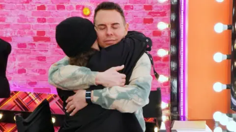 BBC/World of Wonder/Guy Levy Kyran and La Voix hugging in the work room