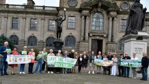 Save the Fellgate Green belt campaigners holding banners at South Shields Town Hall. 