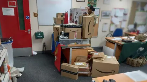 Boxes stacked up on Mrs Knight's desk