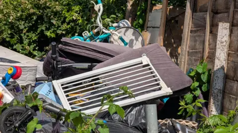 Supplied Mattresses, stair gates and children's bikes fly-tipped.