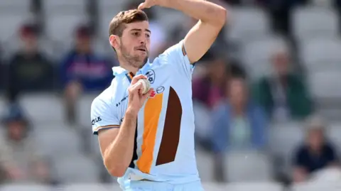 Ben Aitchison bowling for Derbyshire