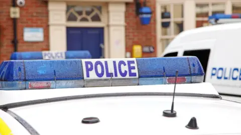 Getty Images Police car outside a police station