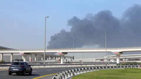 REUTERS/Raghed Waked Smoke rising from an attack on the Jebel Ali port in Dubai.