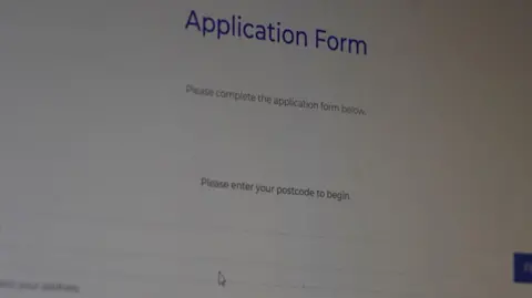 Image of a computer screen on the Scottish Gas website, with the words 'Please complete the application form below' and 'Please enter your postcode to begin'.
