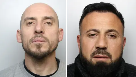 West Yorkshire Police Mugshots of two men. The man of the left is wearing a grey tracksuit and has a bald head and short brown facial hair. The man on the right has short black hair and beard and is wearing a black coat