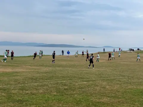 Steve Braughton The Eriskay football pitch, overlooking the sea.