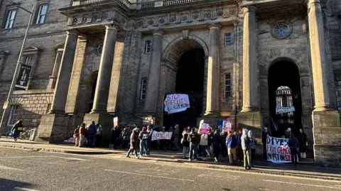 Protesters outside Old College in Edinburgh on Monday.