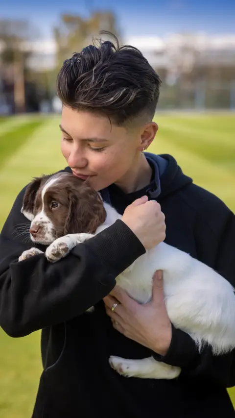 Warwickshire County Cricket Club Issy Wong with puppy Issy