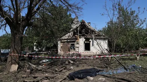 EPA: The site of a rocket impact in a village in Zaporizhia region (Ukraine) on August 26, 2024, after the entire territory of Ukraine came under combined shelling in the morning. 