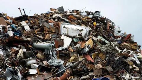 Getty Shows a large amount of waste including a bath and other items piled on top of each other