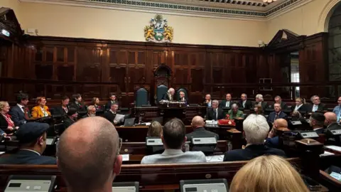 Gemma Dillon Councillors sitting in a chamber