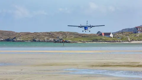 Plane landing at Barra