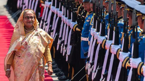 Getty Images Bangladesh's former Prime Minister Sheikh Hasina inspects the guard of honour during a visit to Thailand in 2024
