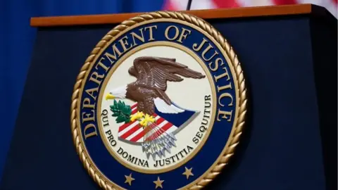 US Department of Justice Seal on blue podium
