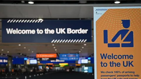 Getty Images UK border signage at the passport control in arrivals in Terminal 2 at Heathrow Airport in 2019