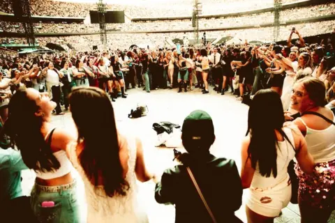 Rosie Carne A huge circle of fans pictured at Harry Styles