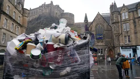 PA Media An overflowing bin in Edinburgh