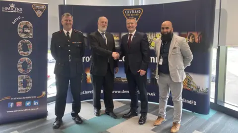 (Left to right) Current chief fire officer Ian Hayton, Fire authority chair David Coupe, incoming chief fire officer Peter Rickard and former fire authority vice chair Sufi Mubeen