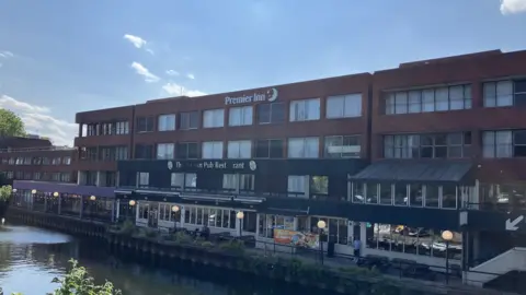 David Freezer/BBC A riverside hotel and restaurant is pictured with a river in the foreground