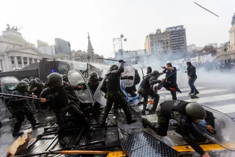 AFP Police and protesters clash on the streets of Buenos Aires on 12 June