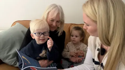 Gemma Stone reading The Man who Hung the Moon to two children 