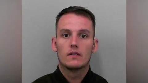 Custody image of Joe Hatherall.