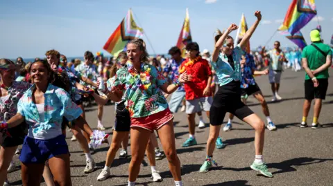 REUTERS/Toby Shepheard People take part in the Brighton & Hove Pride Community Parade during the annual Brighton Pride Festival in Brighton.