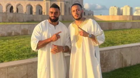 Handout Latif Ayodele and Walid Bouzaghar stand outside a mosque together. 