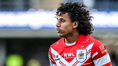 Tristan Sailor in the red and white shirt of St Helens