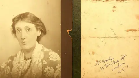 Ewbank's / Geoff Robinson A sepia portrait of Virginia Woolf wearing a patterned dress and a necklace is on the left and the right-hand image shows the reverse of the photograph with handwriting that reads "V Woolf, 52 Tavistock Square, London WC1".
