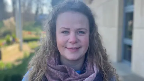 A woman stood outside of Melton Borough Council