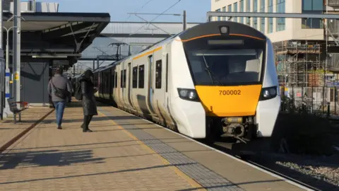 Getty Images A white Thameslink training runs from Bedford to Brighton stops at Brent Cross West station.