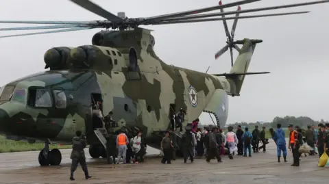 Rodong Sinmun A helicopter reportedly evacuated residents from disaster sites.