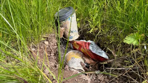 Rubbish found at the side of the road near one industrial estate in Torfaen