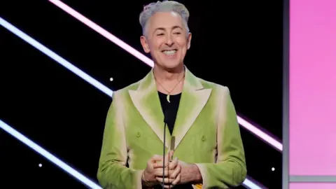 Getty Images Alan Cumming speaks onstage during the 37th Annual American Cinematheque Awards at The Beverly Hilton on February 15, 2024 in Beverly Hills, California