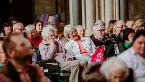 Alastair Brookes Care home residents sitting in the audience