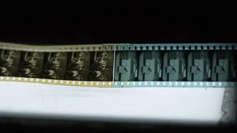 BBC/David Perella Film reel showing with one section in orange and another in blue to denote different scenes in the film