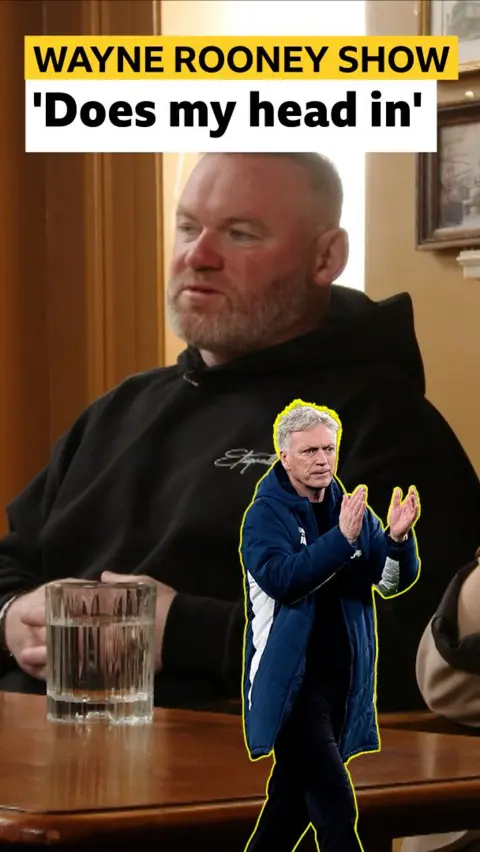 Wayne Rooney and a cutout of David Moyes