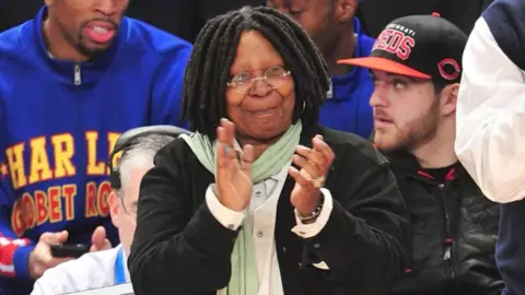 Whoopi Goldberg claps