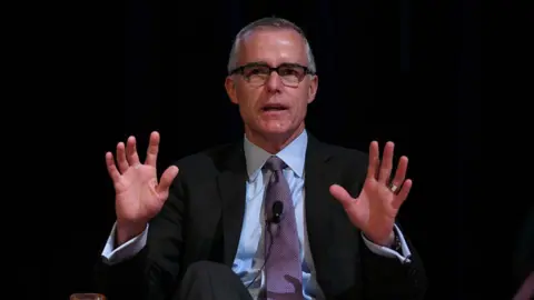 Getty Images Ex-FBI deputy director Andrew McCabe on stage at an event marking his book launch