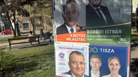 Four posters on a billboard