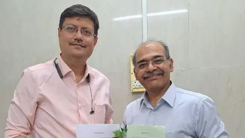 Nikhil Datar Dr Nikhil Datar (right) handing over his living will to the custodian