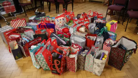 BBC/Claudia Sermbezis Christmas presents